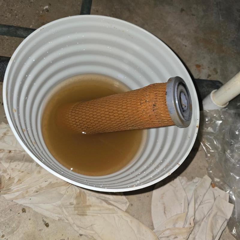 Sedimentary water filter soaking in a bucket