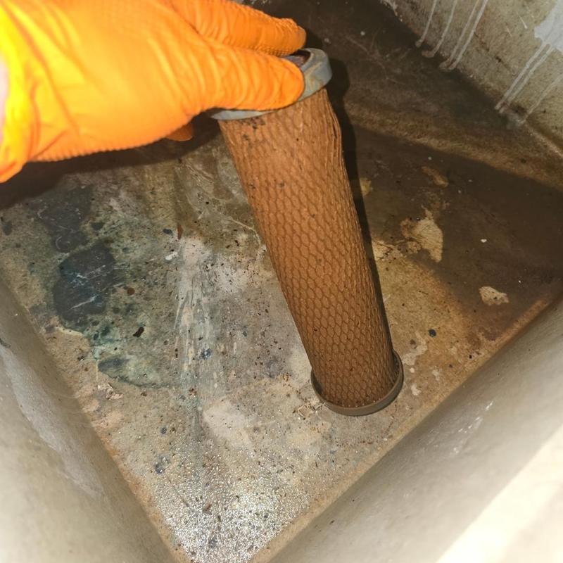 Sedimentary water filter removal with glove hand