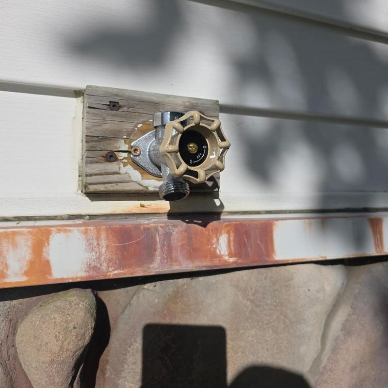 Frost free hose bib with ball valve installed outdoors