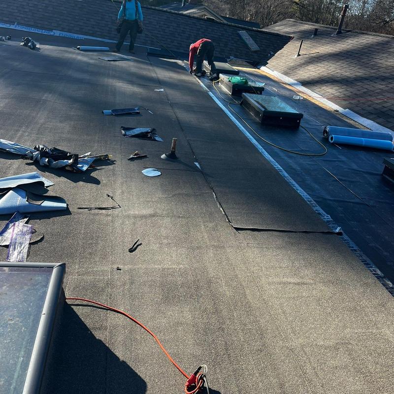 Modified bitumen flat roof with skylight flashing installation Modified bitumen flat roof with skylight flashing installation