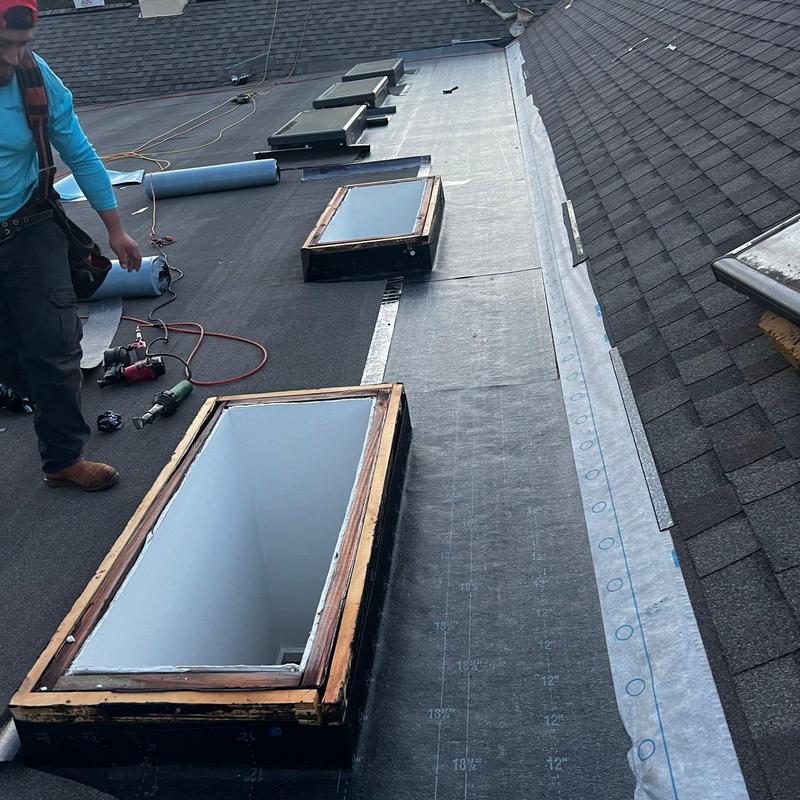 Skylight flashing on modified bitumen flat roof installation Skylight flashing on modified bitumen flat roof installation