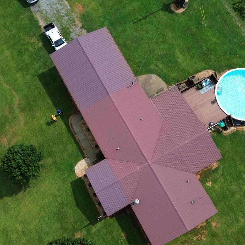 Standing seam metal roof with precise panel alignment Standing seam metal roof with precise panel alignment