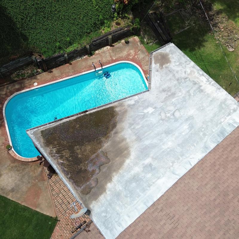 Flat roof membrane with poolside debris buildup Flat roof membrane with poolside debris buildup