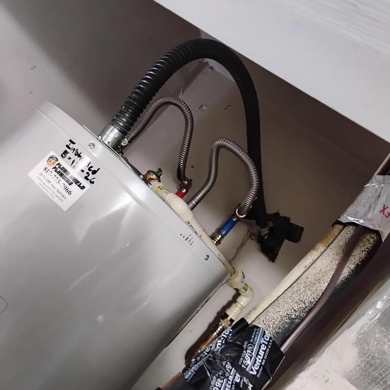 Electric water heater with new piping installation