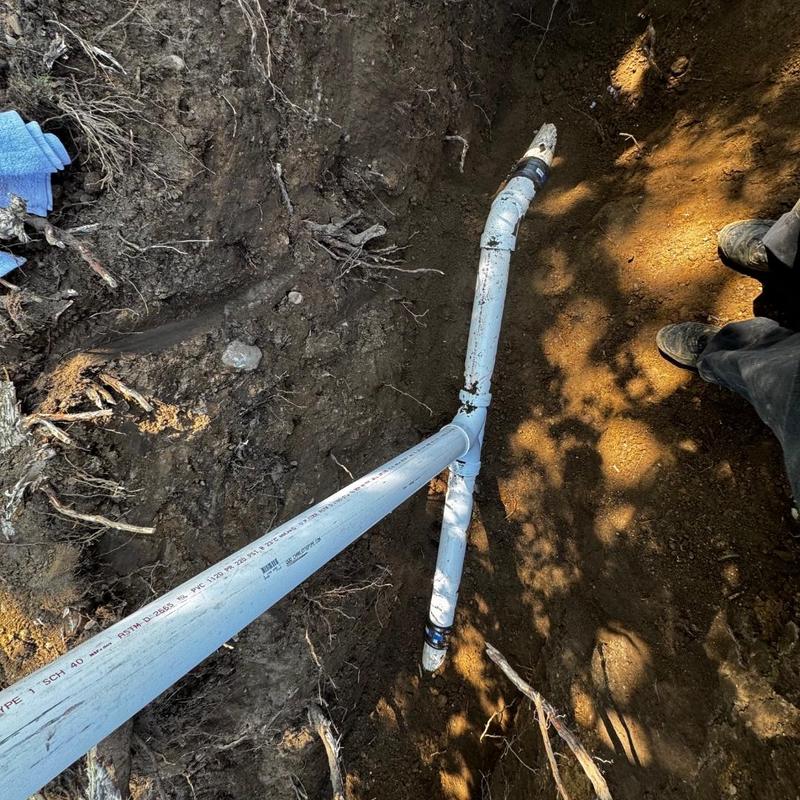 PVC drainage pipe with two-way cleanout in trench