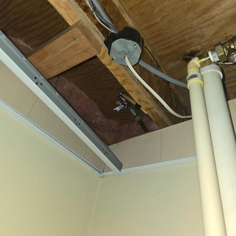 PVC drain pipes and shut off valve installation above ceiling