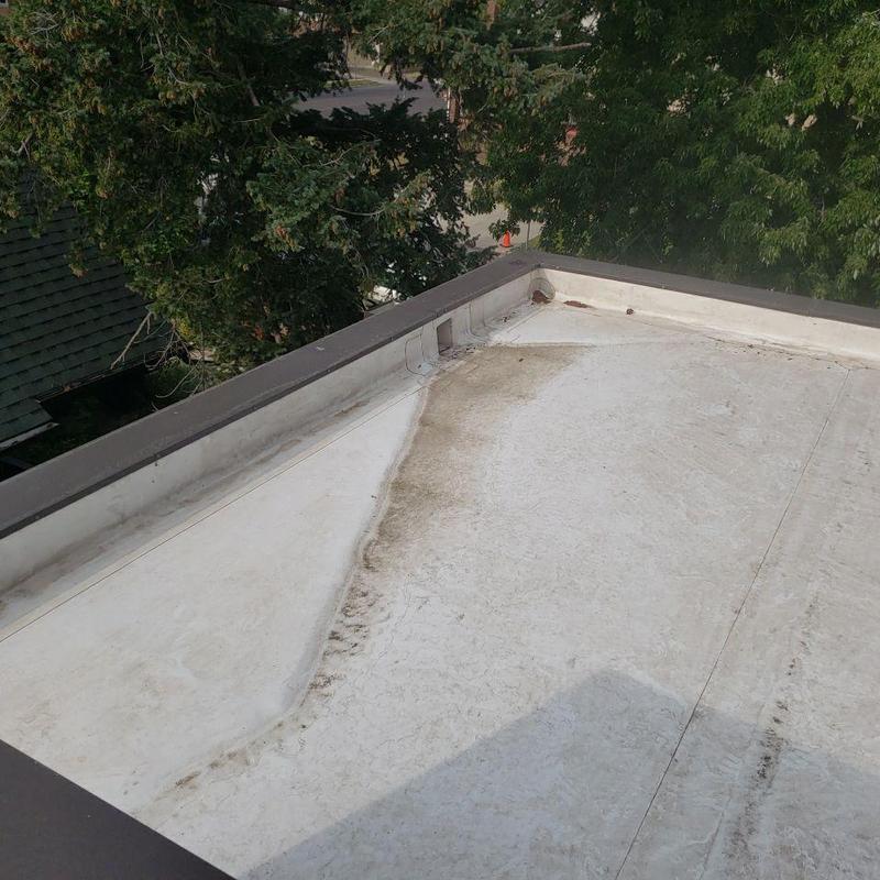 TPO flat roof with repaired seam and water damage TPO flat roof with repaired seam and water damage