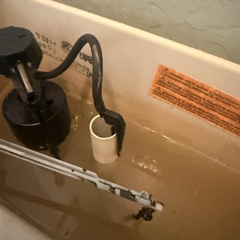 Toilet tank fill valve and overflow tube inside tank Toilet tank fill valve and overflow tube inside tank