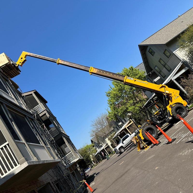 Owens Corning Oakridge roofing system with boom lift Owens Corning Oakridge roofing system with boom lift
