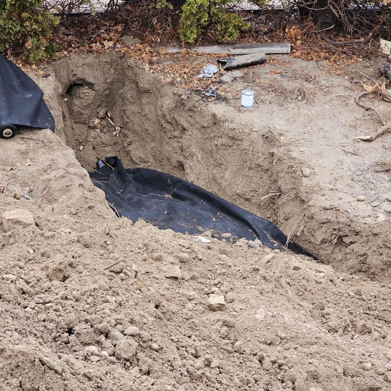 Geothermal DWV piping excavation with protective liner