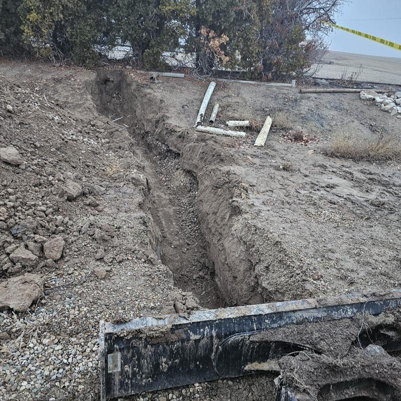 DWV pipe trench excavation for geothermal repair