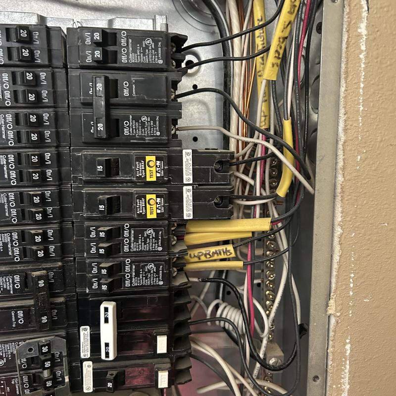 Electrical circuit breaker panel with wiring exposed