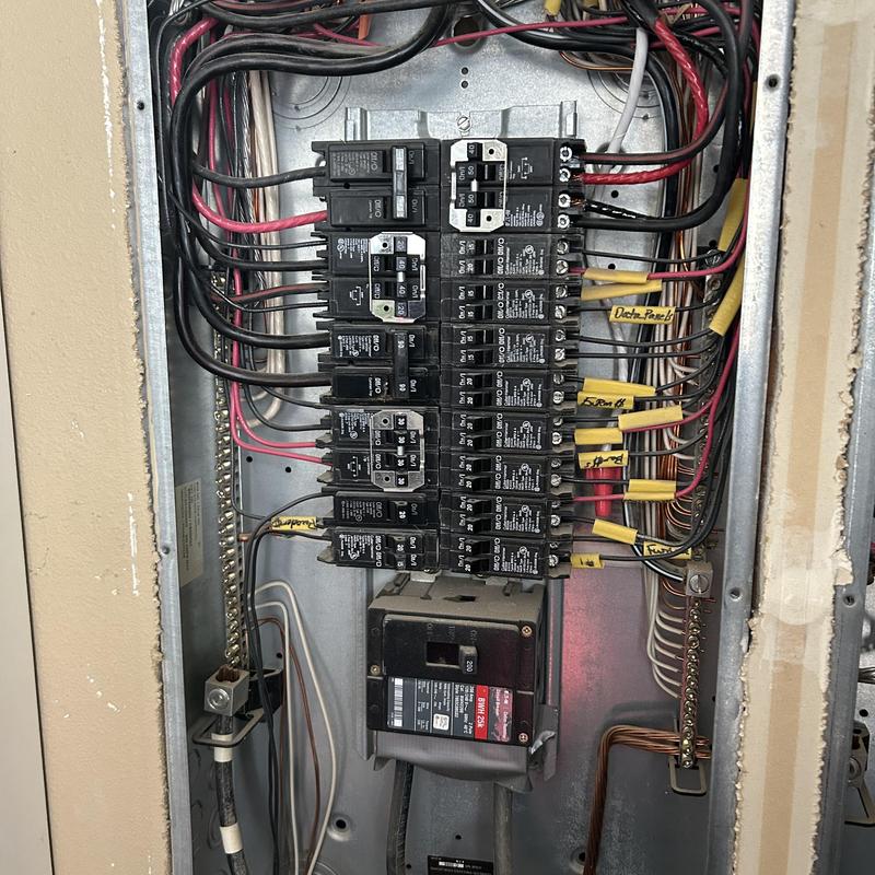 Electrical breaker panel with circuit breakers and wiring