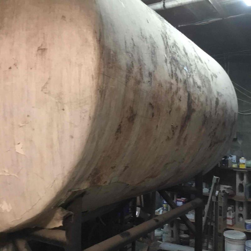 Leaking 800-gallon storage tank in warehouse Leaking 800-gallon storage tank in warehouse