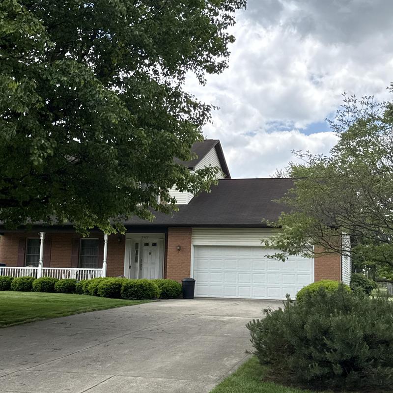 Asphalt roof inspection on suburban home in Ohio