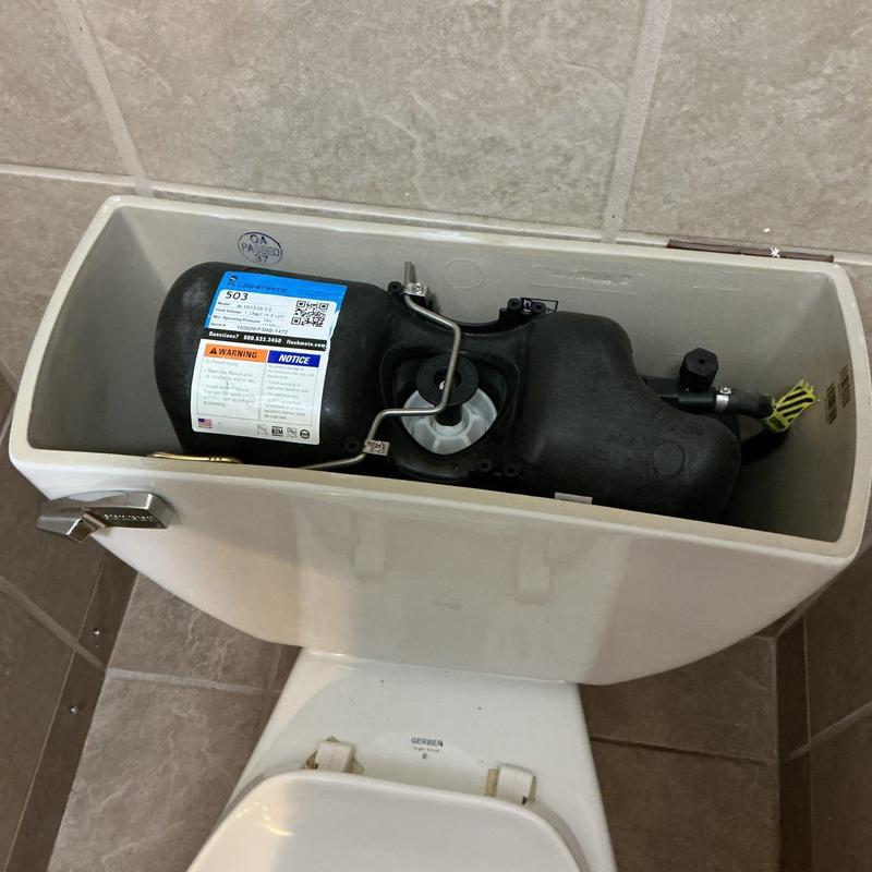 Pressure assist flush toilet tank with replaced cartridge and valve Pressure assist flush toilet tank with replaced cartridge and valve