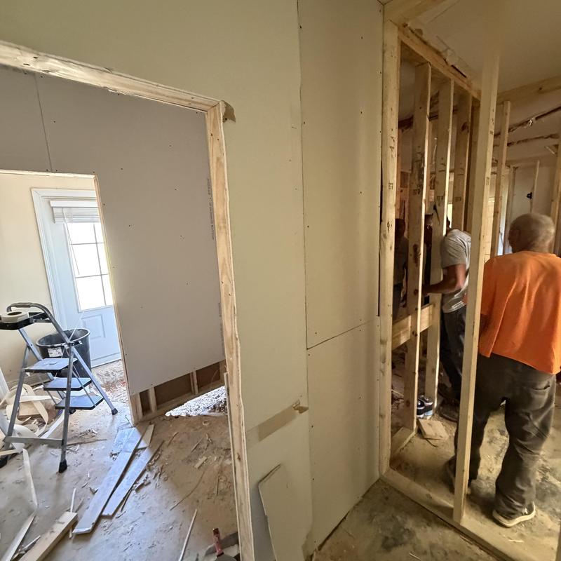 Sheetrock installation on interior wall framing