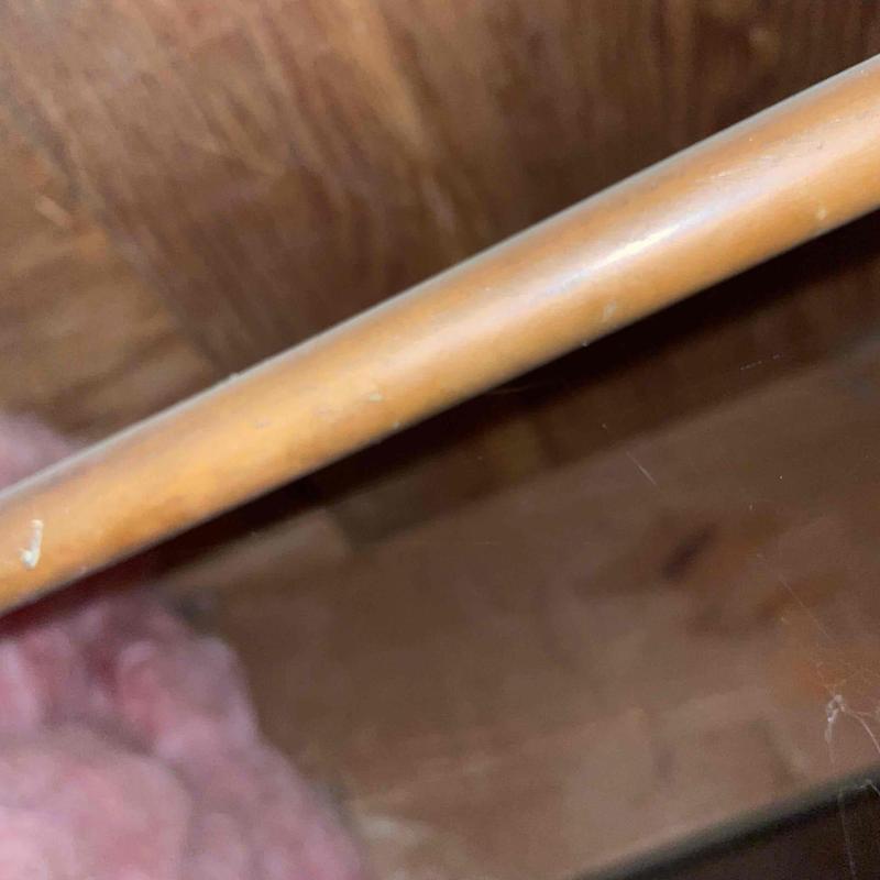 PVC kitchen sink drain pipe with minor wear marks