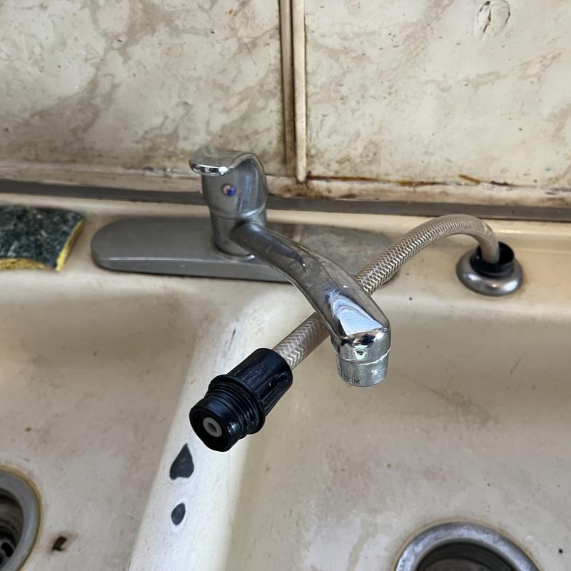 Kitchen faucet with spray handle and supply line disconnected Kitchen faucet with spray handle and supply line disconnected