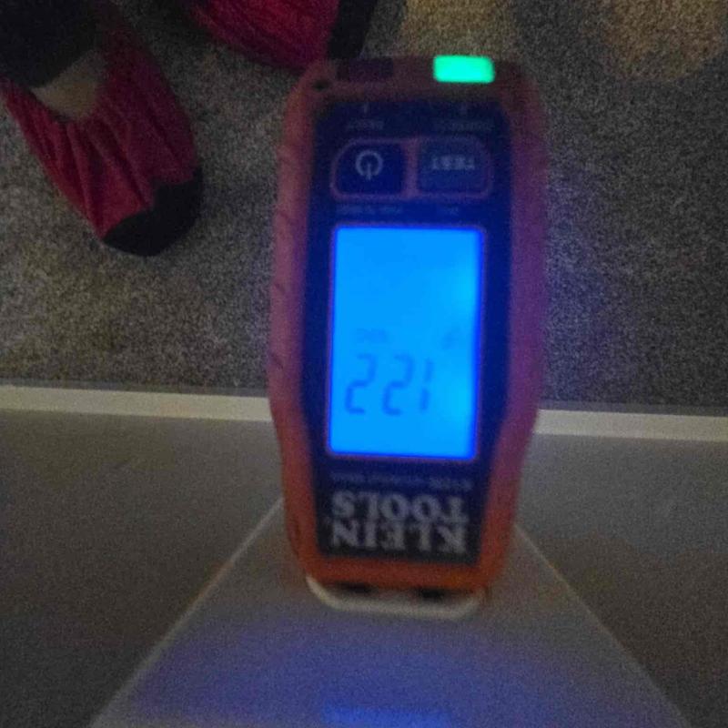Electrical voltage tester showing 221 volts reading Electrical voltage tester showing 221 volts reading