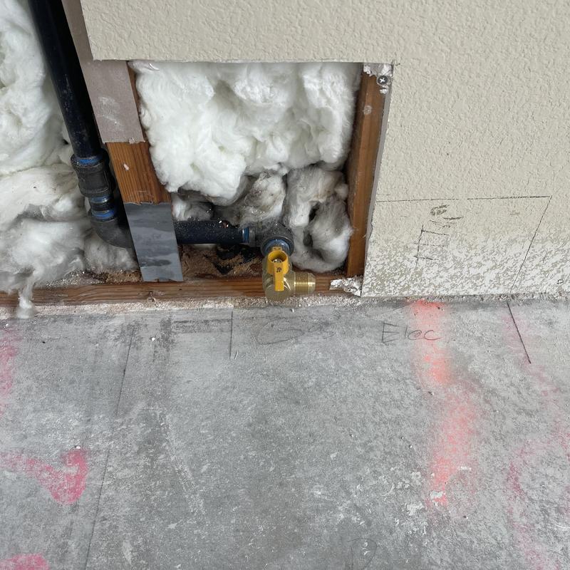 Gas line stub out with black steel pipe and valve