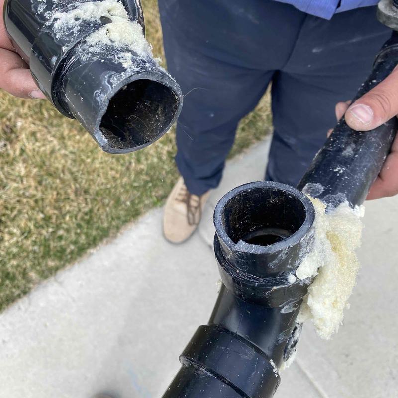 PVC waste pipe with failed joint and sealant residue PVC waste pipe with failed joint and sealant residue