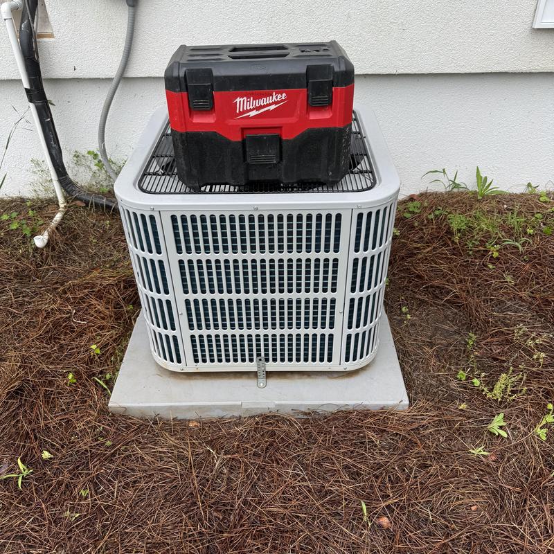 Air conditioner outdoor unit with tool box on top