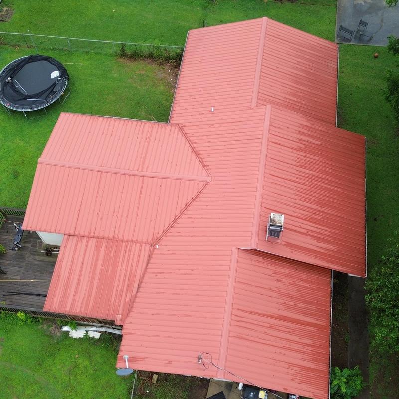Red metal roof with clean panel installation