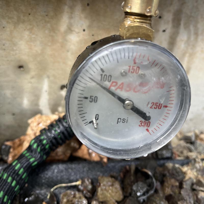 Pressure gauge showing high water pressure above 80 psi
