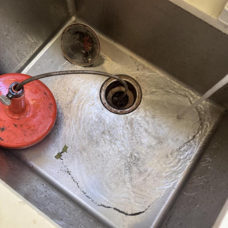 Kitchen sink drain clearing with hand crank cable tool Kitchen sink drain clearing with hand crank cable tool