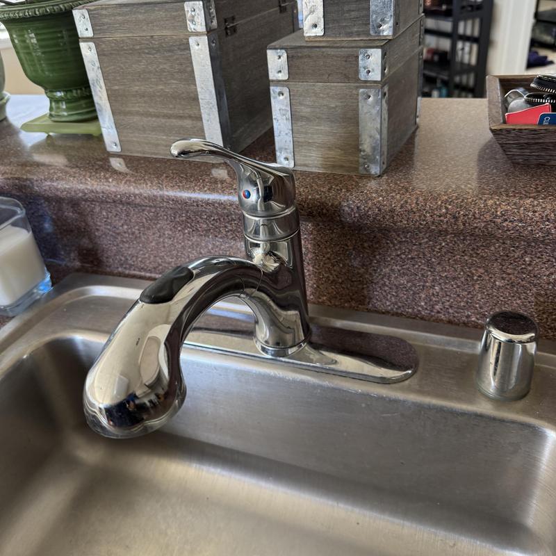 Kitchen faucet installation with clean sink area Kitchen faucet installation with clean sink area