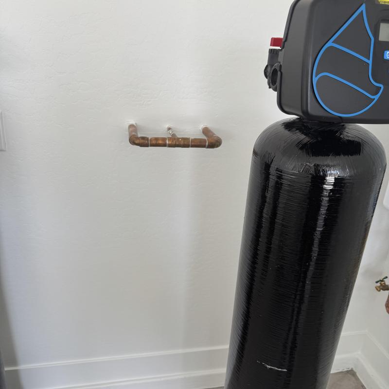 48-case water softener tank with plumbing installation