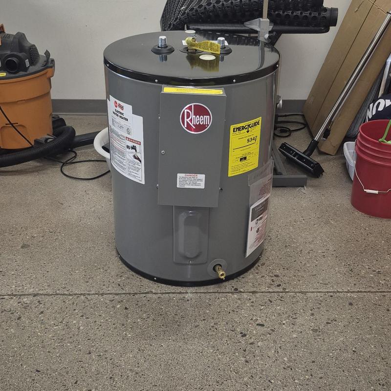 Electric water heater unit with labels and valve Electric water heater unit with labels and valve