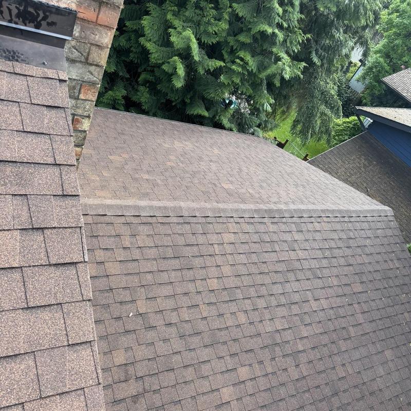 Asphalt shingle roofing with ridge cap installation