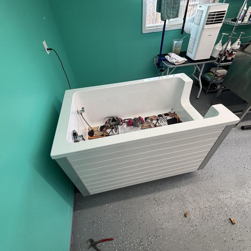 Dog wash station plumbing installation in utility room