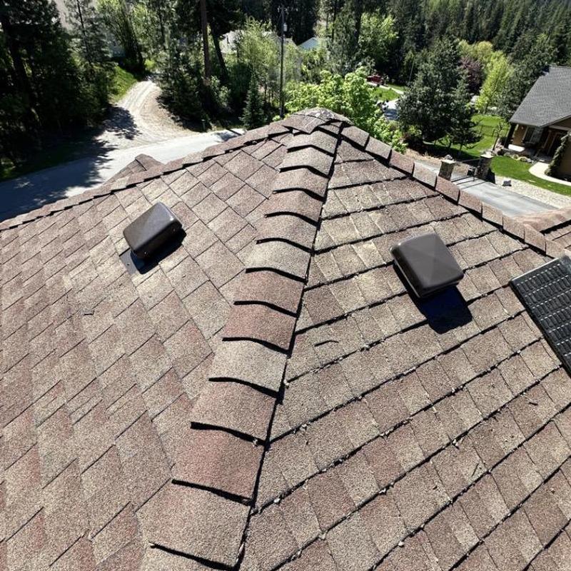 Roof vents installed on shingle roof ridge