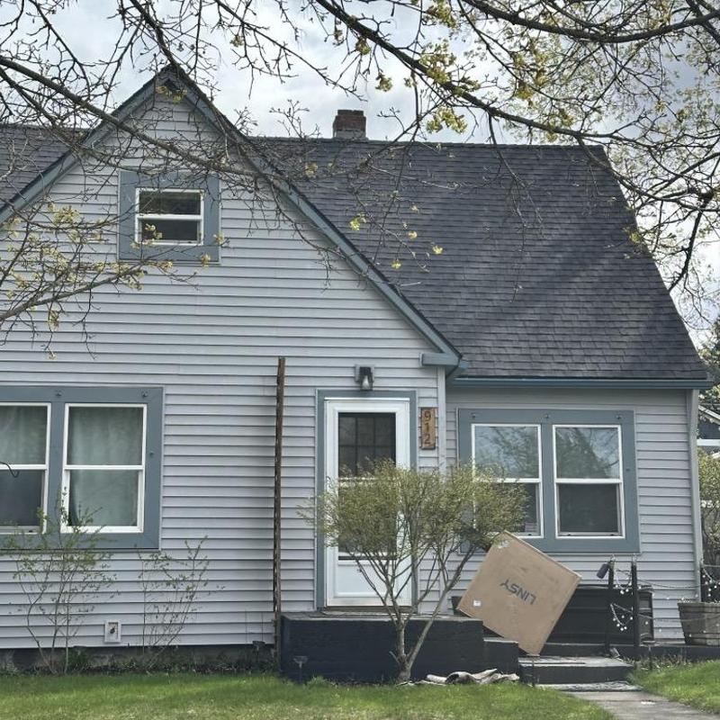 Asphalt shingle roof and gutters on residential house Asphalt shingle roof and gutters on residential house