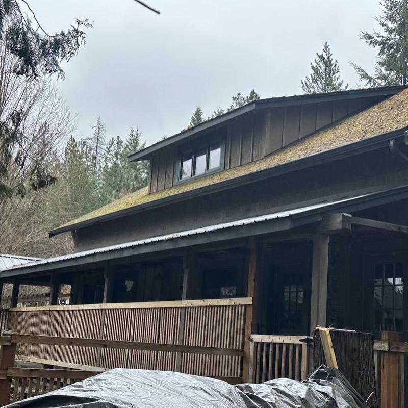 Metal roof and shingle inspection on rustic cabin Metal roof and shingle inspection on rustic cabin