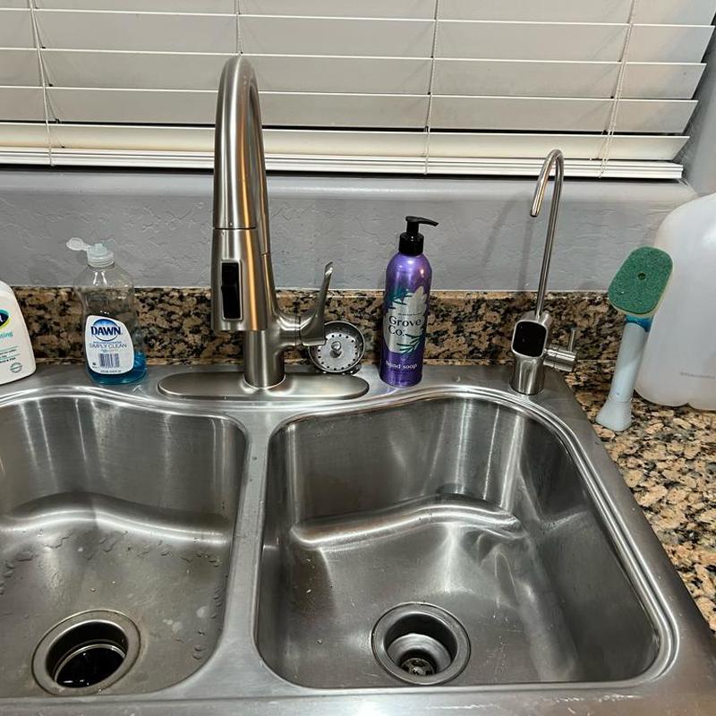 Reverse osmosis faucet and kitchen sink faucet installed