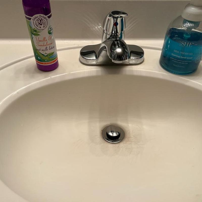 Lavatory faucet installation with chrome fixture
