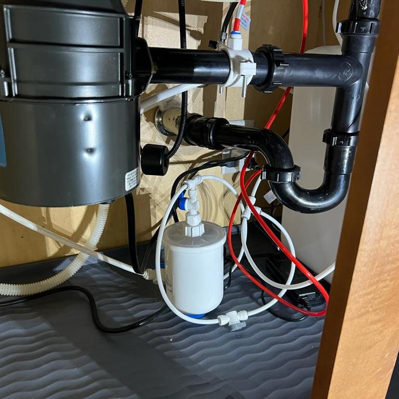 Reverse osmosis system and kitchen sink plumbing installation
