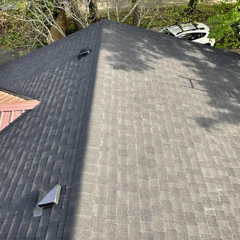 Asphalt shingle roof with ventilation vents and metal dormer Asphalt shingle roof with ventilation vents and metal dormer