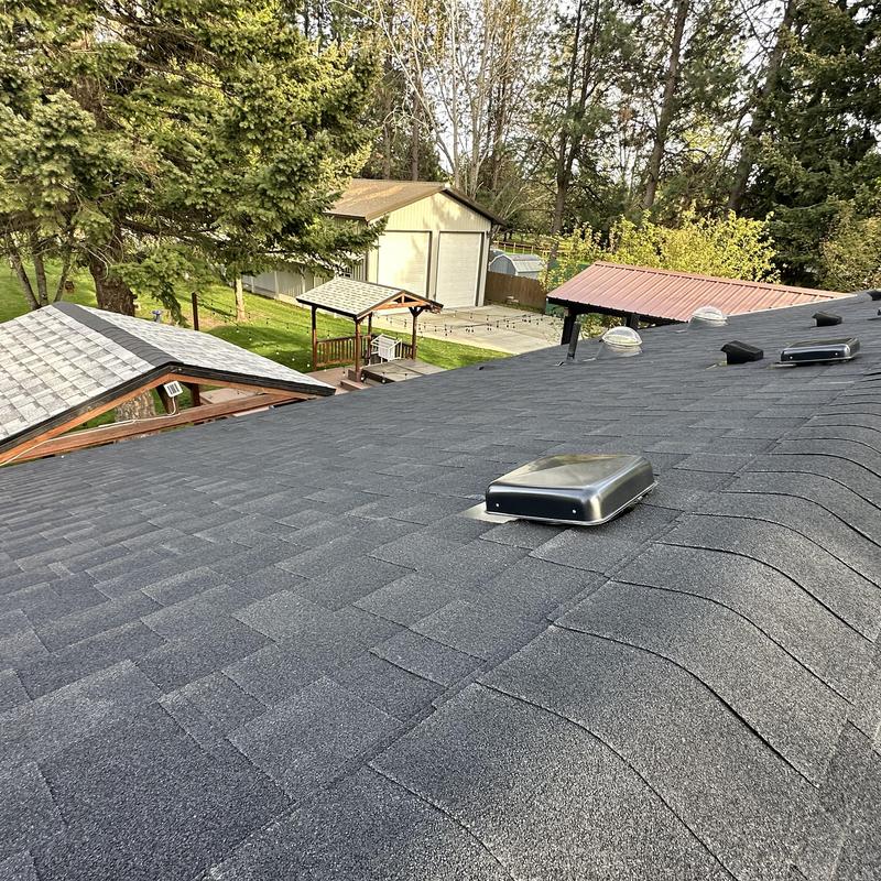 Asphalt shingle roof with vents and metal dormers Asphalt shingle roof with vents and metal dormers