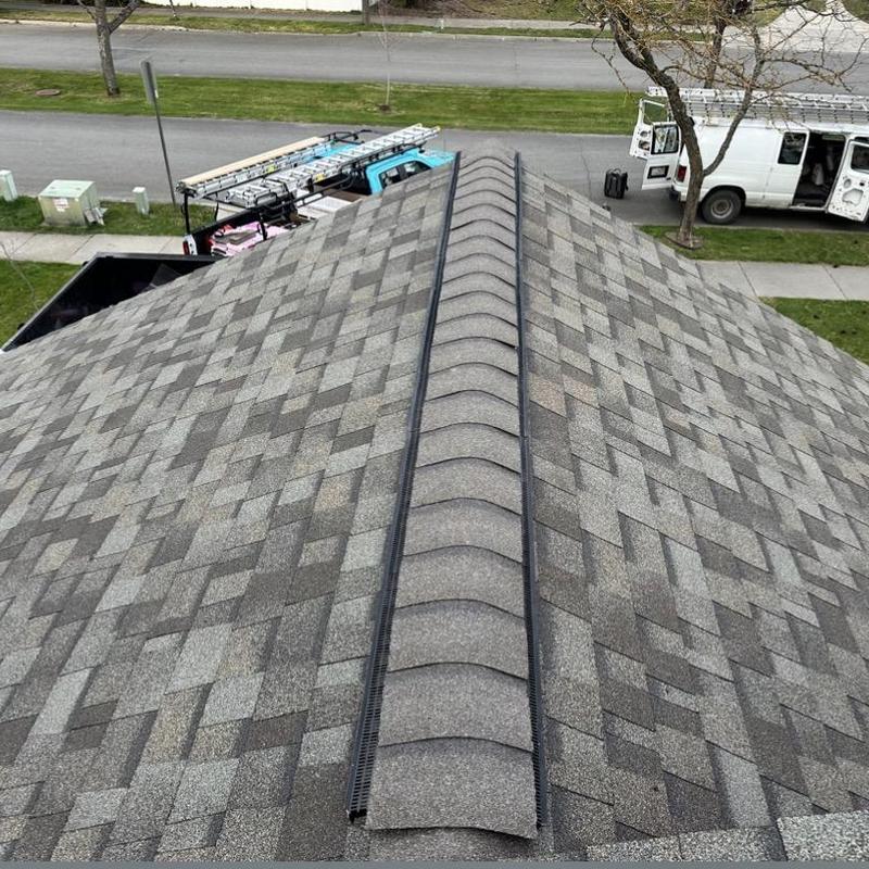 Asphalt shingle roof with ridge vent installation Asphalt shingle roof with ridge vent installation