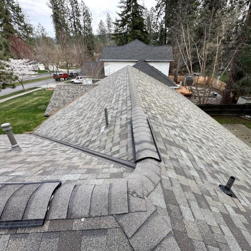Asphalt shingle roof with new ridge vents and vents Asphalt shingle roof with new ridge vents and vents