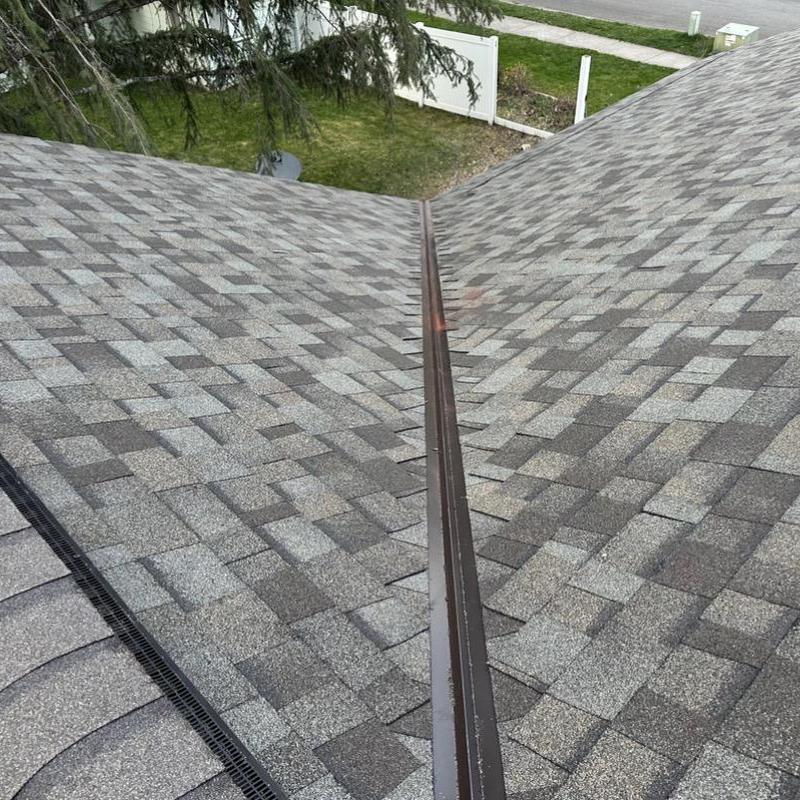 Asphalt shingle roof with metal valley flashing installation Asphalt shingle roof with metal valley flashing installation
