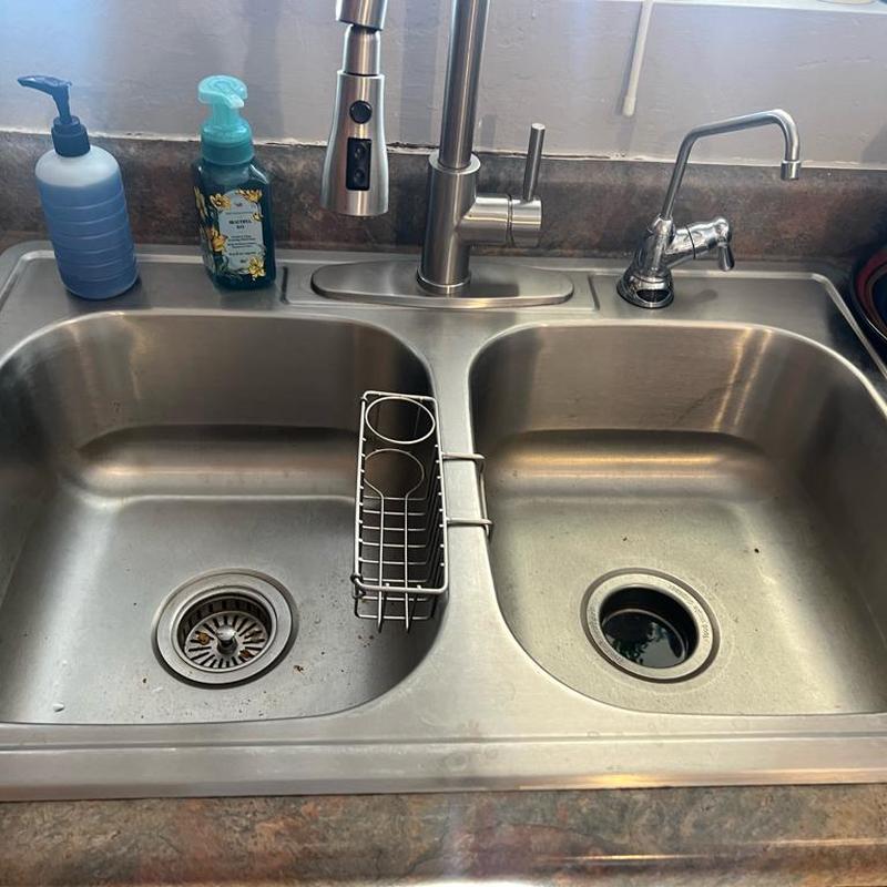 Kitchen sink with dual drains and faucets