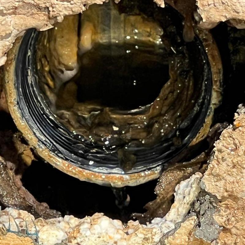 Kitchen sink drain pipe with blockage buildup inside