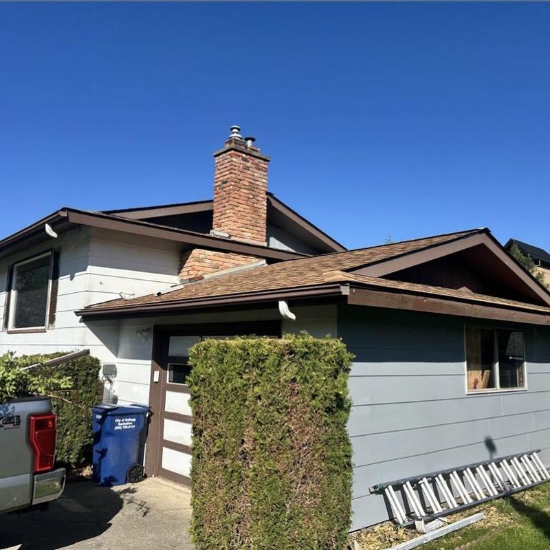 Gutter system on residential home with inspection ladder Gutter system on residential home with inspection ladder