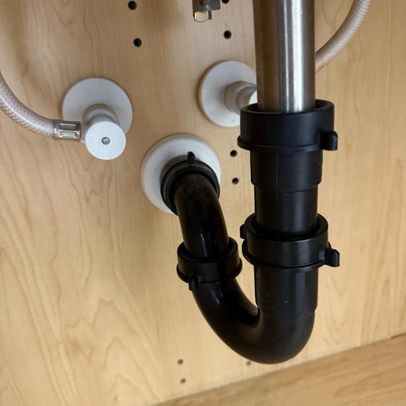 Bathroom sink drain trap and supply valves installed